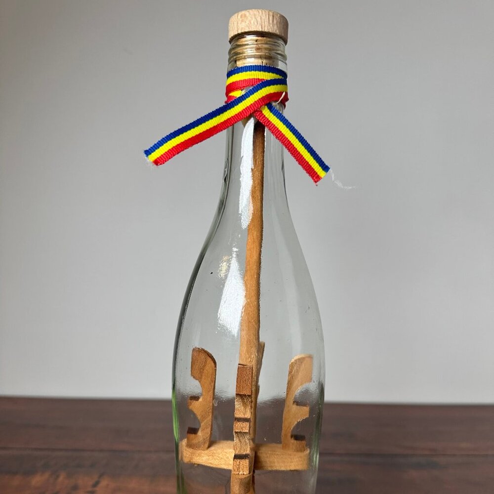 Unique Decorative Ship in a Bottle with Wooden Sculptures